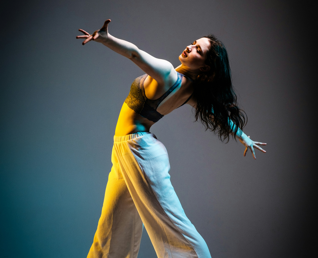 Dance poses in with dramatic lighting in front of a neutral background