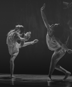 Black and white image of two dancers performing a modern dance routine
