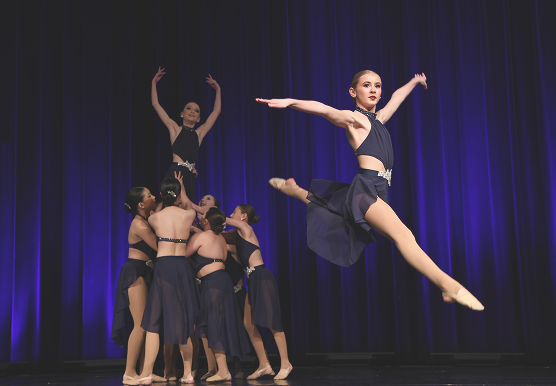 Dancers performing a lift during a Frequency Dance Challenge team routine